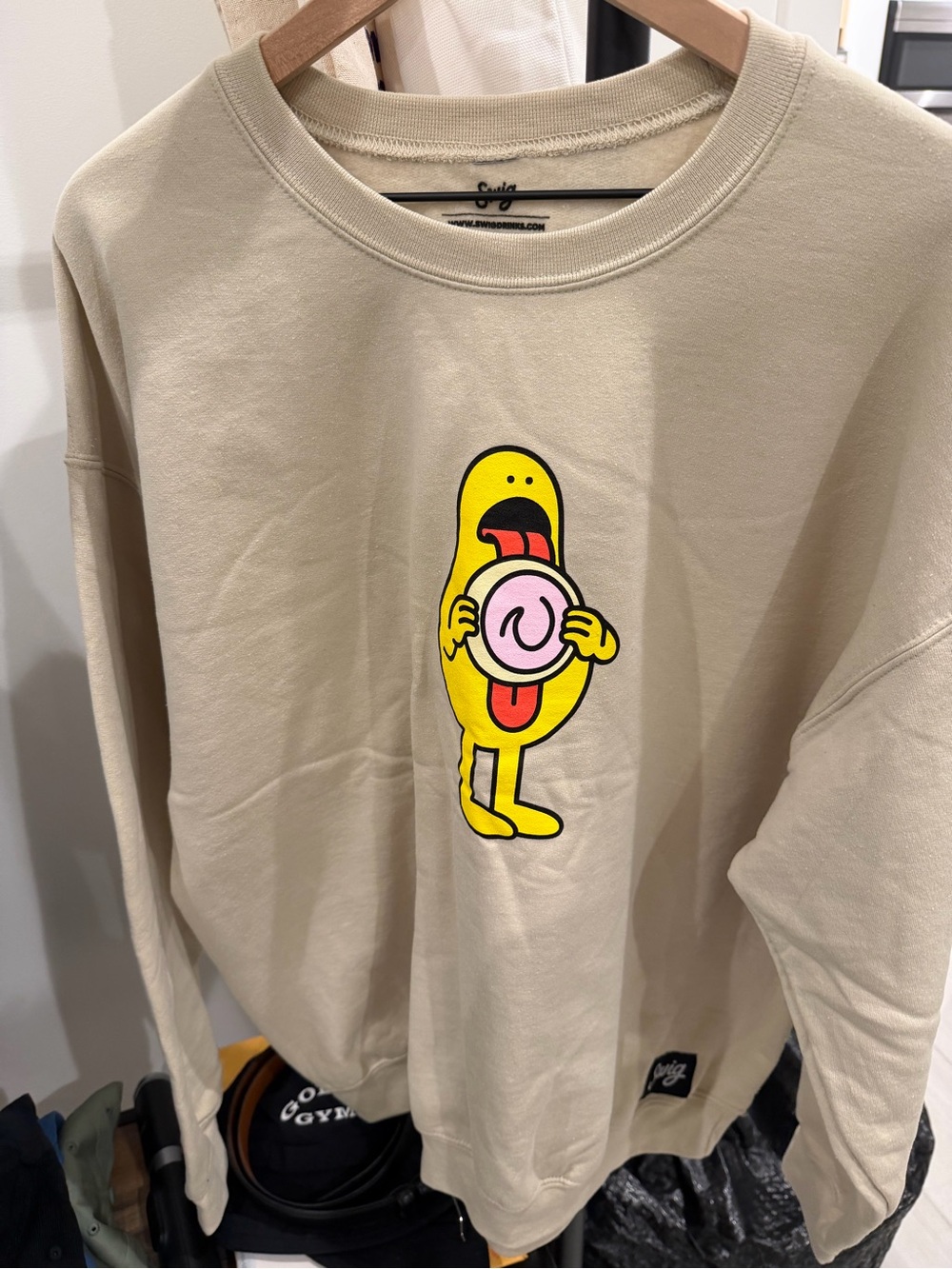 Beige Sweatshirt with Yellow Cartoon Donut Character